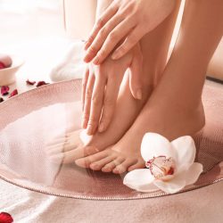 Young,Woman,Undergoing,Spa,Pedicure,Treatment,In,Beauty,Salon Young woman undergoing spa pedicure treatment in beauty salon